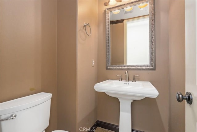 bathroom featuring toilet