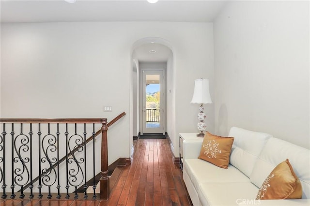 hallway with dark hardwood / wood-style flooring