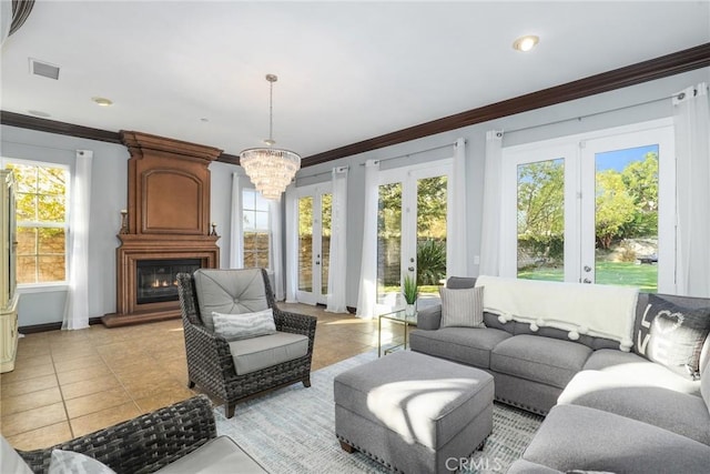 living room with light tile patterned floors, ornamental molding, a fireplace, and visible vents