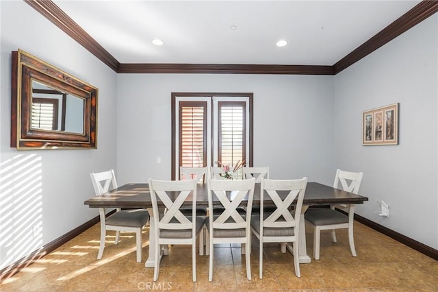 dining space featuring ornamental molding