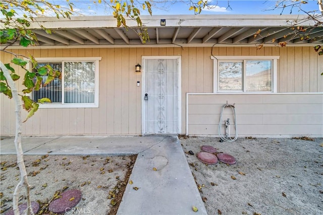 doorway to property featuring a patio