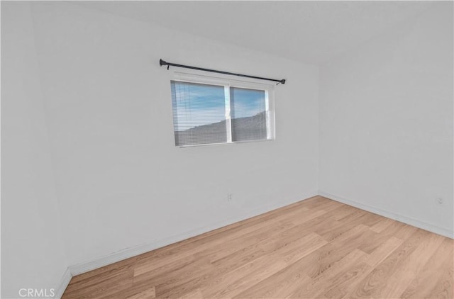 empty room with light hardwood / wood-style floors