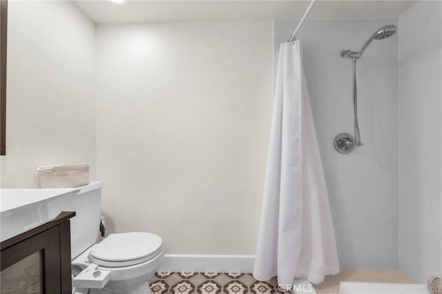 bathroom featuring vanity, toilet, and a shower with shower curtain