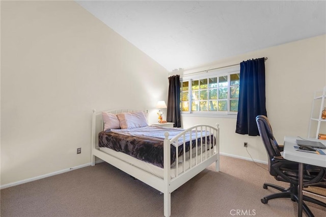 bedroom featuring vaulted ceiling and carpet