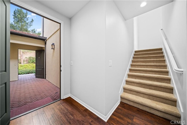 entryway with dark hardwood / wood-style floors