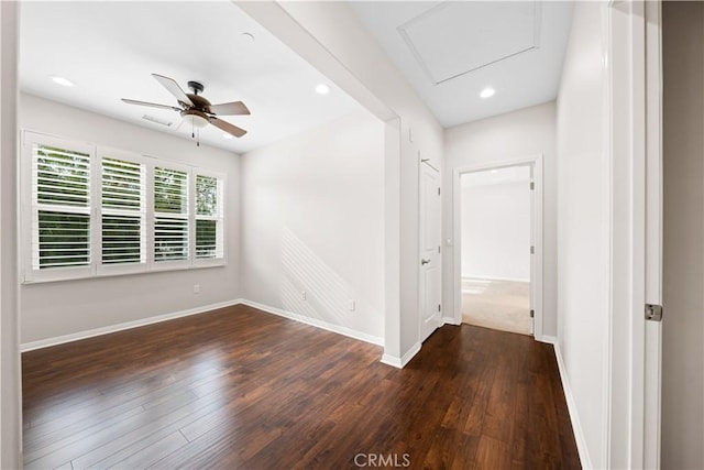 unfurnished room featuring ceiling fan and dark wood-type flooring