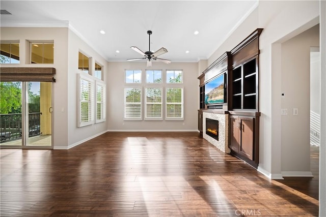 unfurnished living room with dark hardwood / wood-style floors, ceiling fan, and ornamental molding