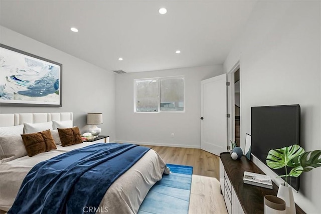 bedroom with light hardwood / wood-style flooring