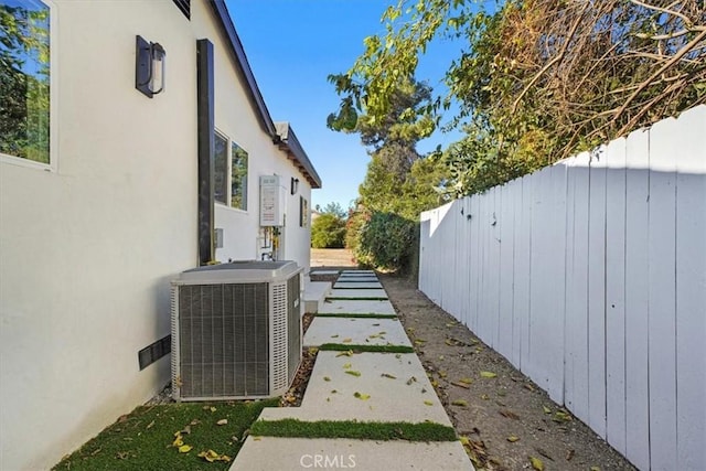 view of yard with central AC unit