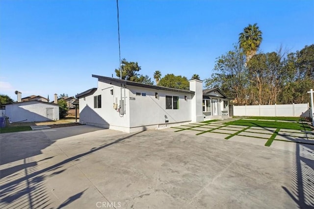 rear view of house with a patio area