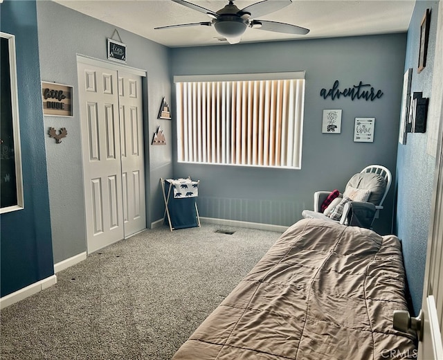 bedroom featuring ceiling fan, carpet flooring, and a closet