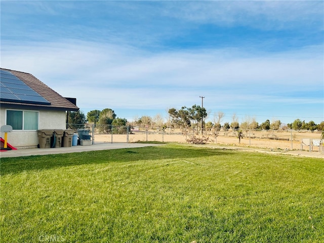 view of yard with a rural view