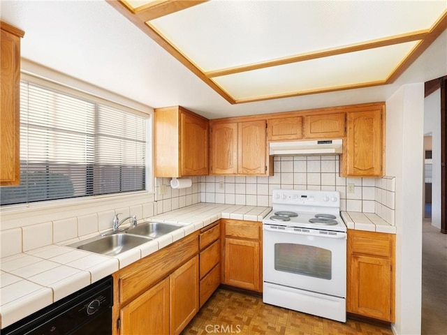 kitchen featuring dishwasher, white electric range, tile counters, and sink