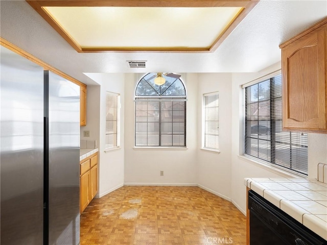 unfurnished dining area featuring ceiling fan