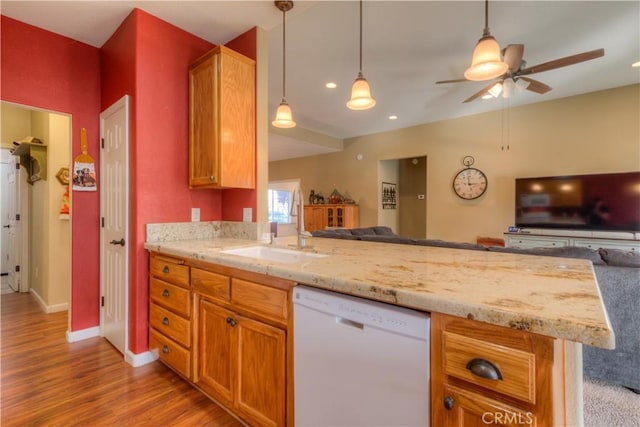 kitchen featuring ceiling fan, sink, kitchen peninsula, white dishwasher, and light hardwood / wood-style floors