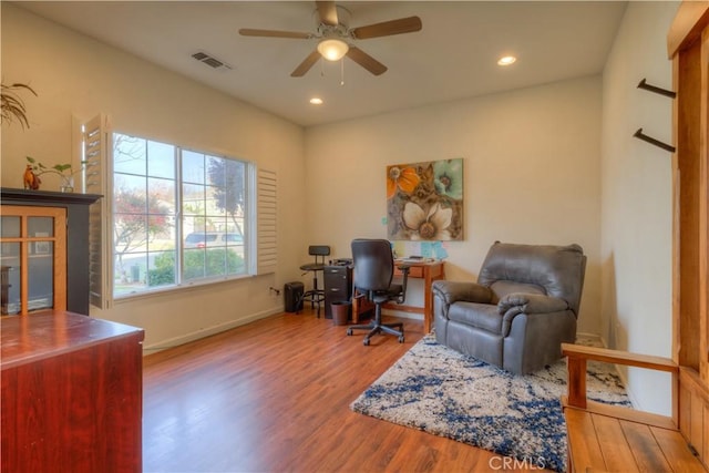 office space featuring hardwood / wood-style floors and ceiling fan