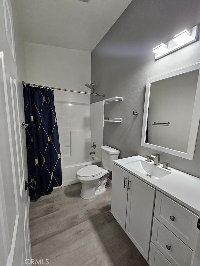 full bathroom featuring wood-type flooring, vanity, toilet, and shower / bath combo