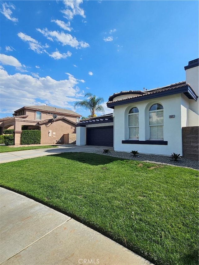 view of property exterior with a yard and a garage