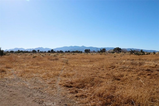 property view of mountains featuring a rural view