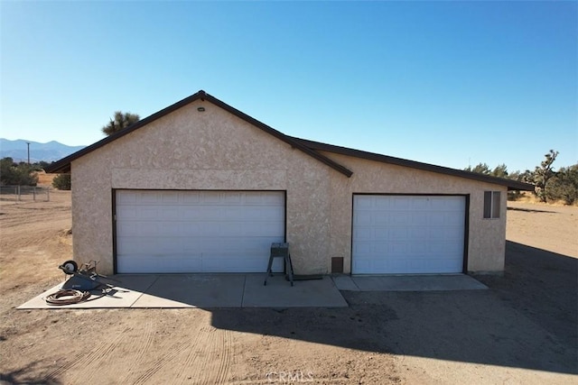 garage featuring a mountain view