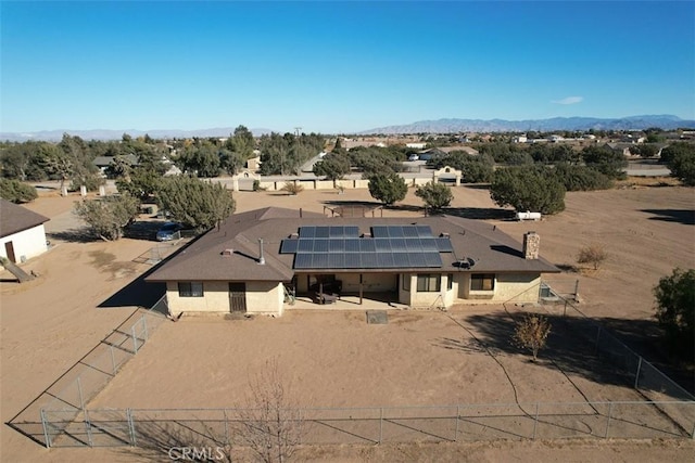 birds eye view of property featuring a mountain view