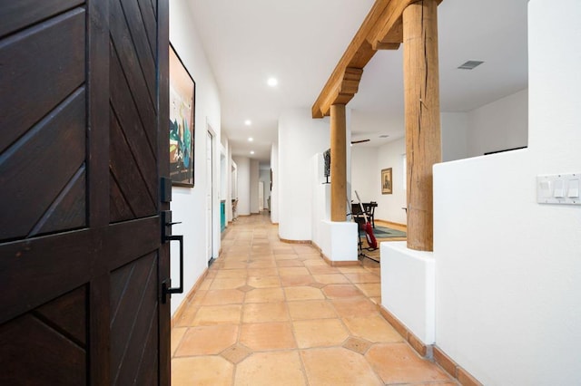 hallway with light tile patterned floors