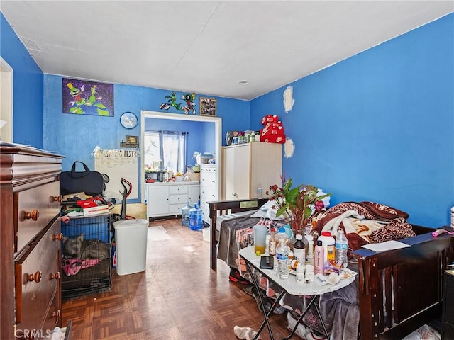 bedroom featuring parquet floors