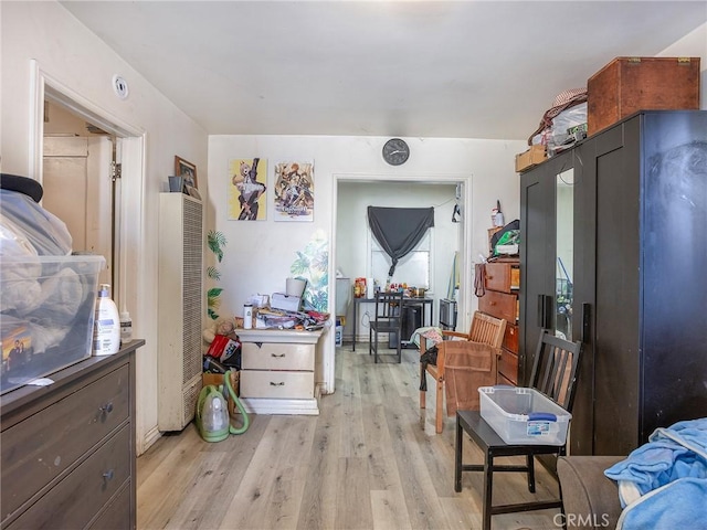 bedroom with light hardwood / wood-style floors