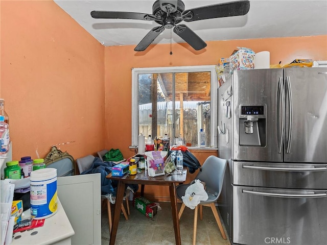 kitchen with ceiling fan and stainless steel refrigerator with ice dispenser