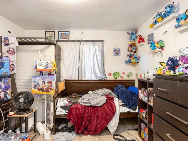 bedroom with light hardwood / wood-style flooring