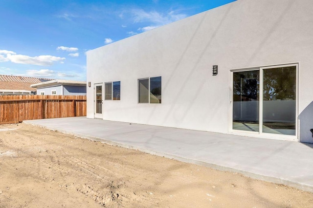 rear view of house with a patio