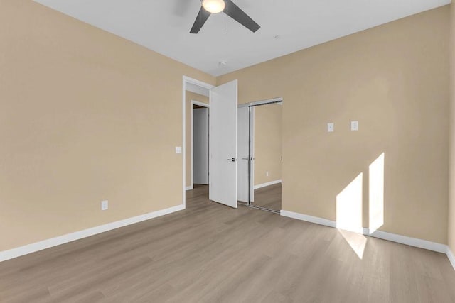 spare room with ceiling fan and light hardwood / wood-style floors