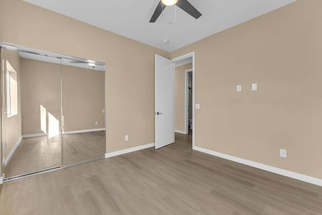 spare room with ceiling fan and light hardwood / wood-style flooring