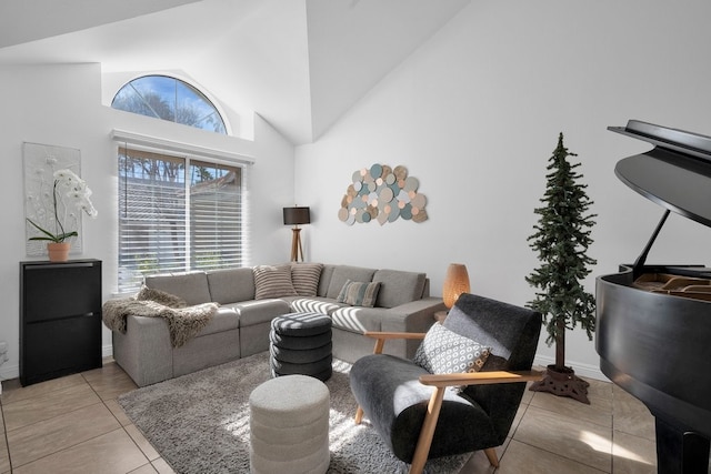 living room featuring light tile patterned floors and high vaulted ceiling