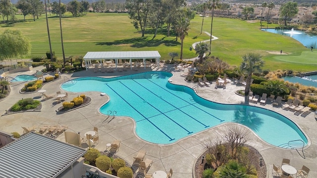 view of pool with a water view