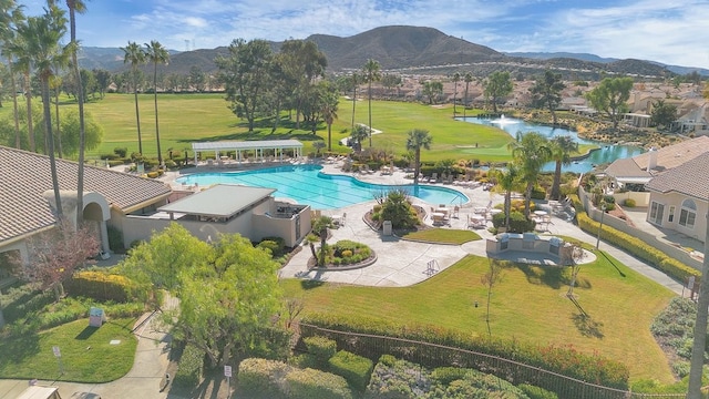 birds eye view of property featuring a water and mountain view