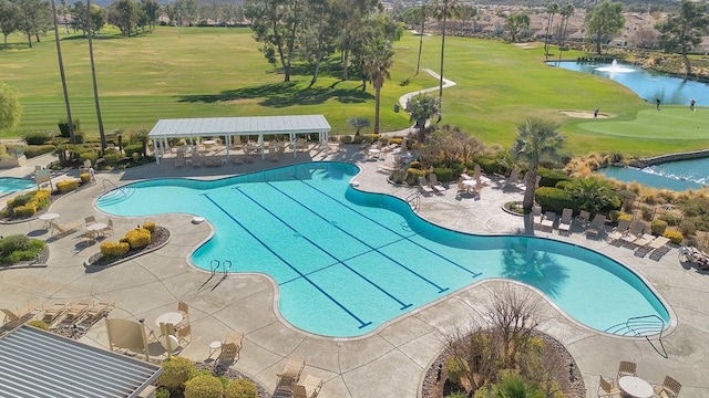 view of swimming pool with a water view