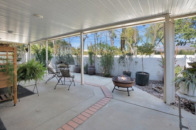 view of patio with an outdoor fire pit