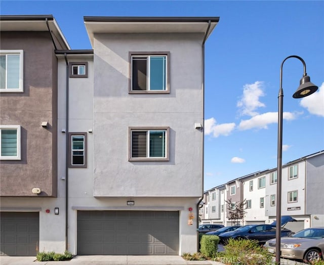 townhome / multi-family property featuring a garage