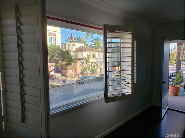 doorway featuring ornamental molding