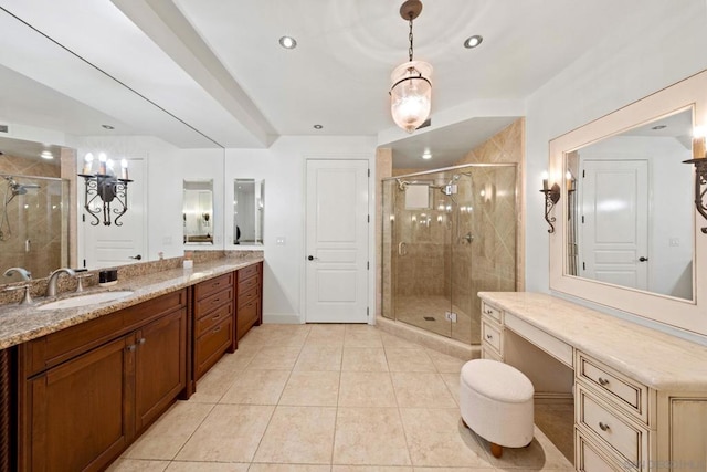 bathroom with tile patterned flooring, vanity, and a shower with shower door