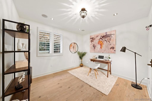 office area with light hardwood / wood-style flooring