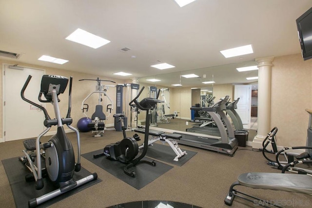 workout area featuring ornate columns