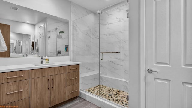 bathroom featuring vanity and walk in shower