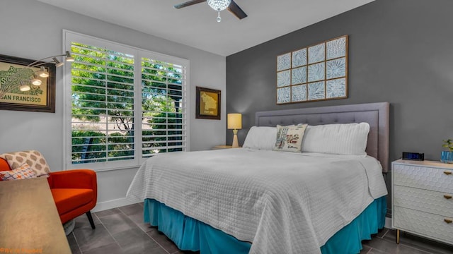 tiled bedroom with ceiling fan