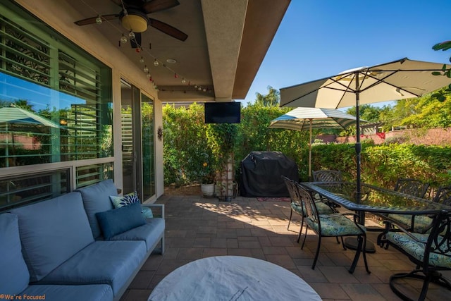 view of patio with outdoor lounge area and grilling area