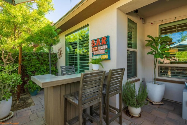 view of patio / terrace featuring exterior bar