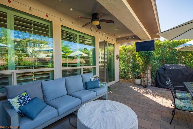 view of patio with an outdoor living space, ceiling fan, and grilling area