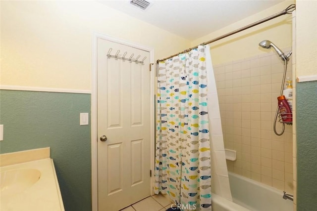 bathroom featuring tile patterned floors, sink, and shower / bath combo