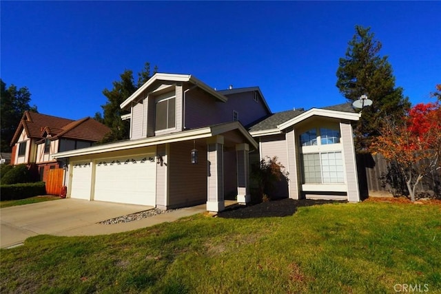 view of front of home featuring a garage and a front yard